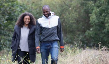 A couple walking and laughing together