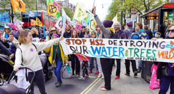 'Stop HS2' supporters with placards march along Oxford Street